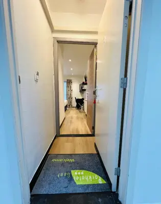 a hallway with a door leading to a room at Parkhotel Gent Centrum in Ghent