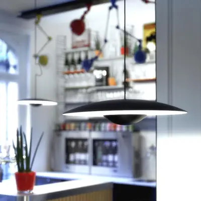 aendant light hanging over a counter in a kitchen at Vintage Hotel Brussels in Brussels