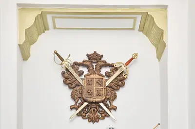 a coat of arms hanging on a door at Hotel Derby MERODE in Brussels