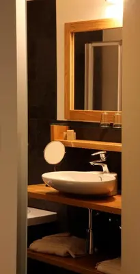 a bathroom with a sink and a mirror at Boardhousing in Leuven