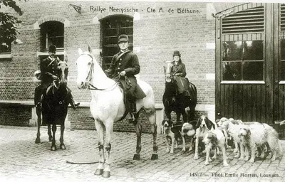 a black and white photo of people on horses and dogs at B&B Baron’s House Neerijse-Leuven in Neerijse
