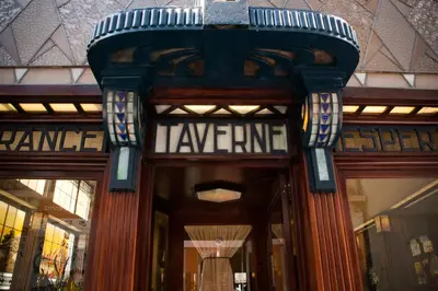 a front door of a building with a sign on it at Hotel Esperance in Brussels