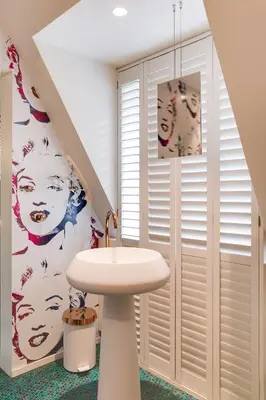 a bathroom with a sink and a staircase at Hotel De Witte Lelie -Small Luxury Hotels of the World in Antwerp