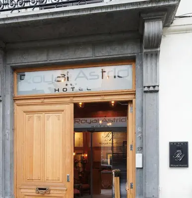 a door to a store with a sign above it at Hotel Royal Astrid in Aalst
