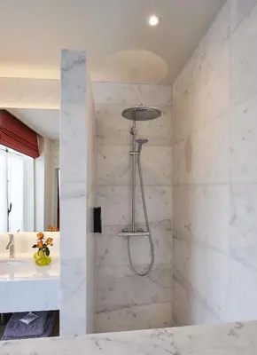 a bathroom with a shower and a sink at Hotel Royal Astrid in Aalst
