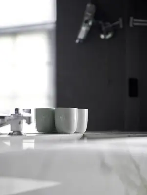 two cups sitting on top of a kitchen counter at Hotel Odette en Ville in Brussels