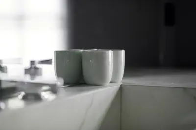 two cups sitting on top of a counter at Hotel Odette en Ville in Brussels