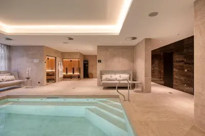 a room with a swimming pool in a hotel room at Corsendonk Hooge Heyde in Lichtaart