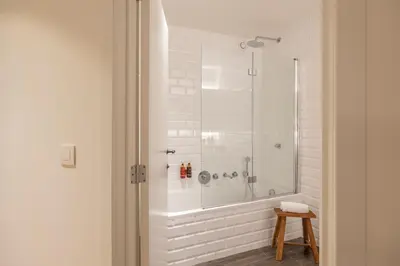 a bathroom with a shower with a glass door at Corsendonk Hooge Heyde in Lichtaart