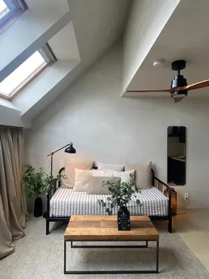 a living room with a couch and a table at Edville Studio in Ghent