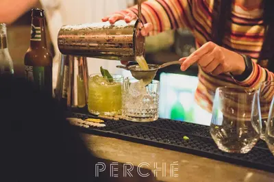 a bartender making a drink at a bar at JAM Brussels in Brussels