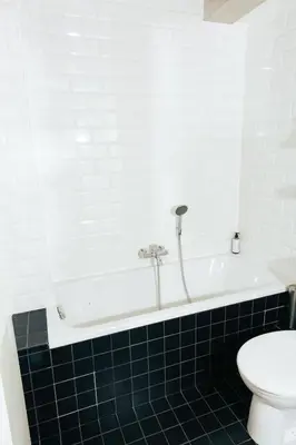 a bathroom with a white tub and a toilet at JAM Brussels in Brussels