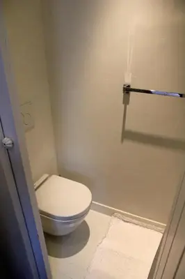 a bathroom with a white toilet in a room at L'Epicentre in Brussels