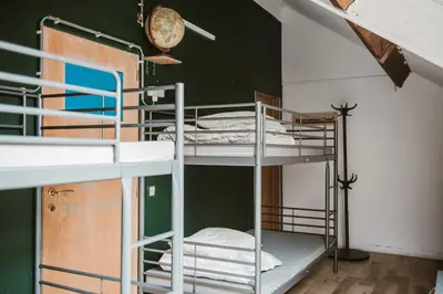 a couple of bunk beds in a room at Treck Hostel in Ghent