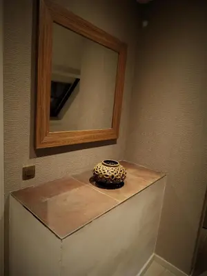 a vase sitting on top of a counter under a mirror at Villa Einstein Apartments in Antwerp