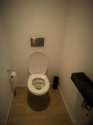 a bathroom with a white toilet in a room at Villa Einstein Apartments in Antwerp