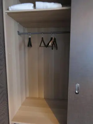 a closet with three hangers with panties on it at Villa Einstein Apartments in Antwerp