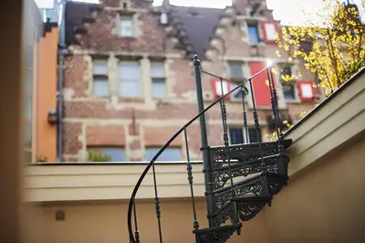 a balcony on the side of a building at B&B Maryline in Antwerp