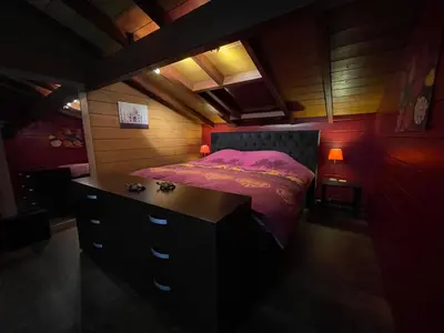 a small bedroom with a bed and a dresser at Casa Delux in Lille