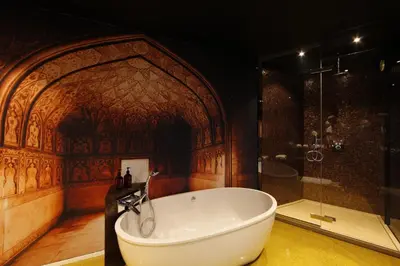 a large bathroom with a tub and a shower at Koto Garden Suites in Antwerp