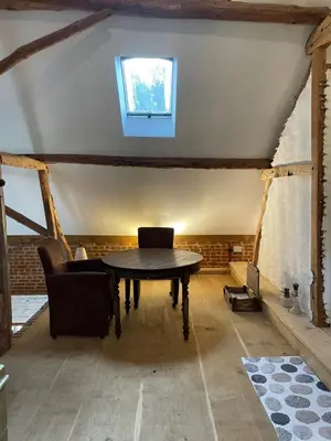 a dining room with a table and chairs in a attic at Art Of Einstein in Diest