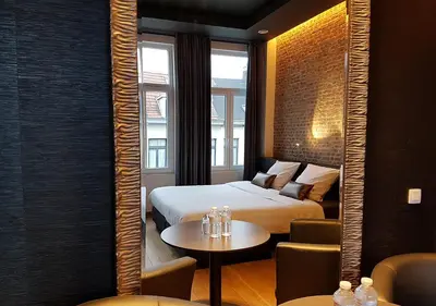 a hotel room with a bed and a table at Hotel Goodnight Antwerp in Antwerp