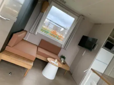 a living room with a couch and a window at Lake Park in Berlare