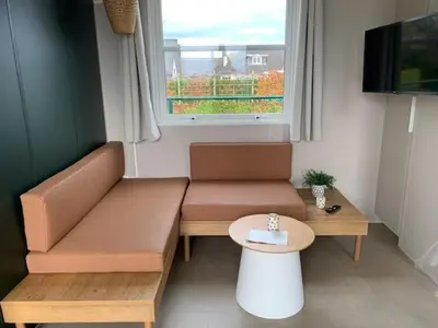 a living room with a couch and a table at Lake Park in Berlare