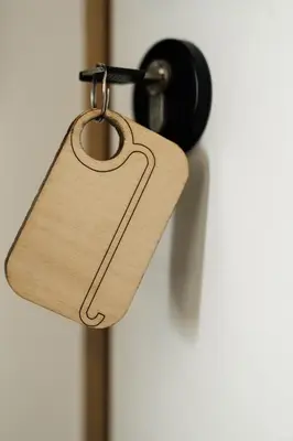 a wooden tag hanging from a door knob at Befour in Aalst