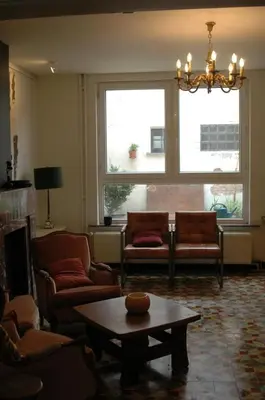 a living room with couches and a coffee table at Holiday Home near town in Aarschot
