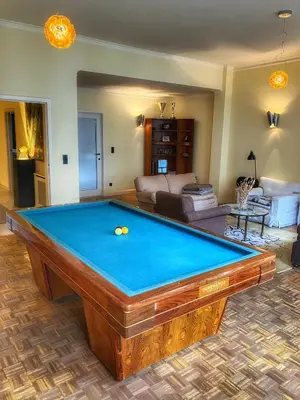 a living room with a pool table at CitytripGent Apartment in Ghent