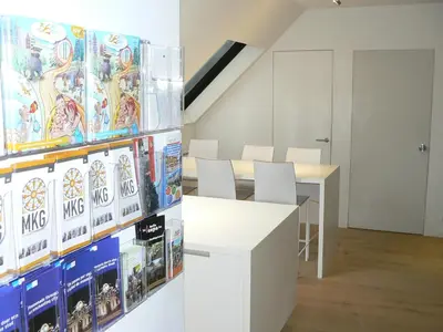 a room with a bunch of video games on the wall at Stay in Ghent in Ghent