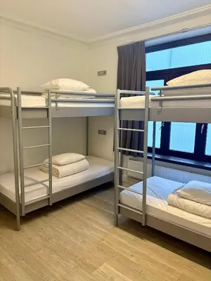 a room with three bunk beds in it at The Legacy by 2GO4 City Center in Brussels