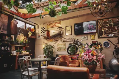 a room with a table and chairs and plants on the wall at The Legacy by 2GO4 City Center in Brussels