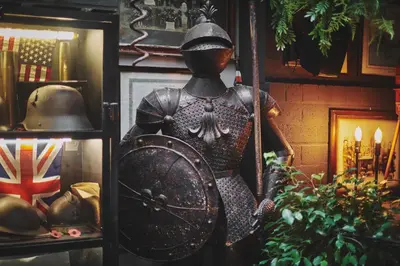 a statue of a man holding a shield in a room at The Legacy by 2GO4 City Center in Brussels