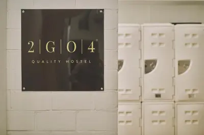 a sign on a wall in a room with lockers at The Legacy by 2GO4 City Center in Brussels
