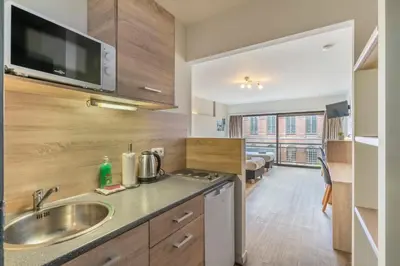 a kitchen with a sink and a counter top at Value Stay Residence Mechelen in Mechelen