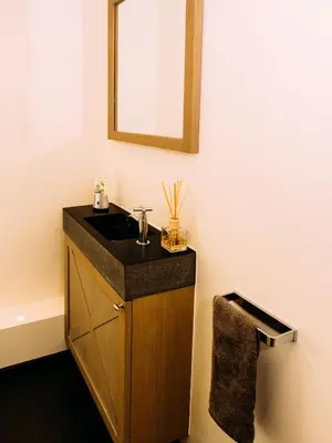 a bathroom with a sink and a mirror at Maison Willem Tell in Ghent