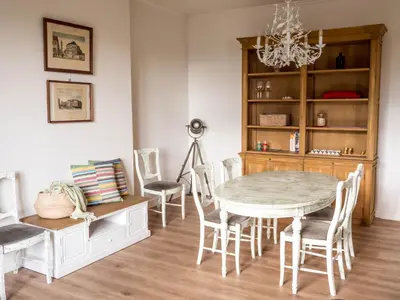 a dining room with a table and chairs at Maison Willem Tell in Ghent