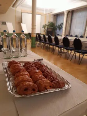 a tray of donuts on a table in a room at Hotel Le Dome in Brussels