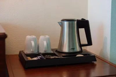 a coffee maker sitting on top of a table at Park Hotel Brussels in Brussels