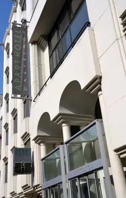 a building with a sign on the side of it at Castelnou Aparthotel in Ghent