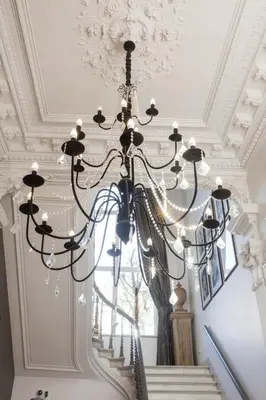a chandelier hanging from a ceiling at Hotel Gravensteen in Ghent