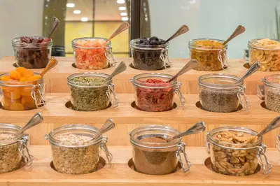 a display of different types of food in jars at Thon Hotel Bristol Stephanie in Brussels