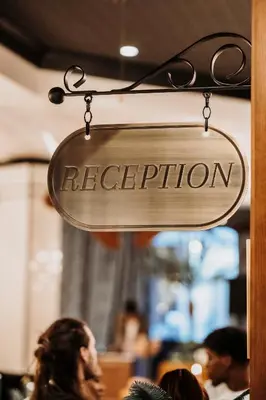 a sign for a restaurant hanging from a wall at Craves in Brussels