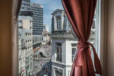 a view of a city street from a window at Safestay Brussels Grand Place in Brussels