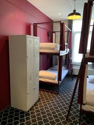 a room with two bunk beds in a room at Safestay Brussels Grand Place in Brussels