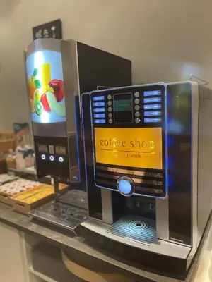 a coffee machine sitting on a shelf in a store at Safestay Brussels Grand Place in Brussels