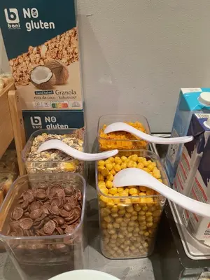 a group of containers of food with toothbrushes and nuts at Safestay Brussels Grand Place in Brussels