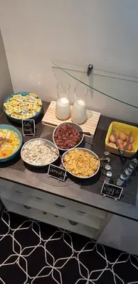 a table with many different types of food on it at Safestay Brussels Grand Place in Brussels